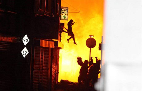 A woman jumps from a burning building in Croyden