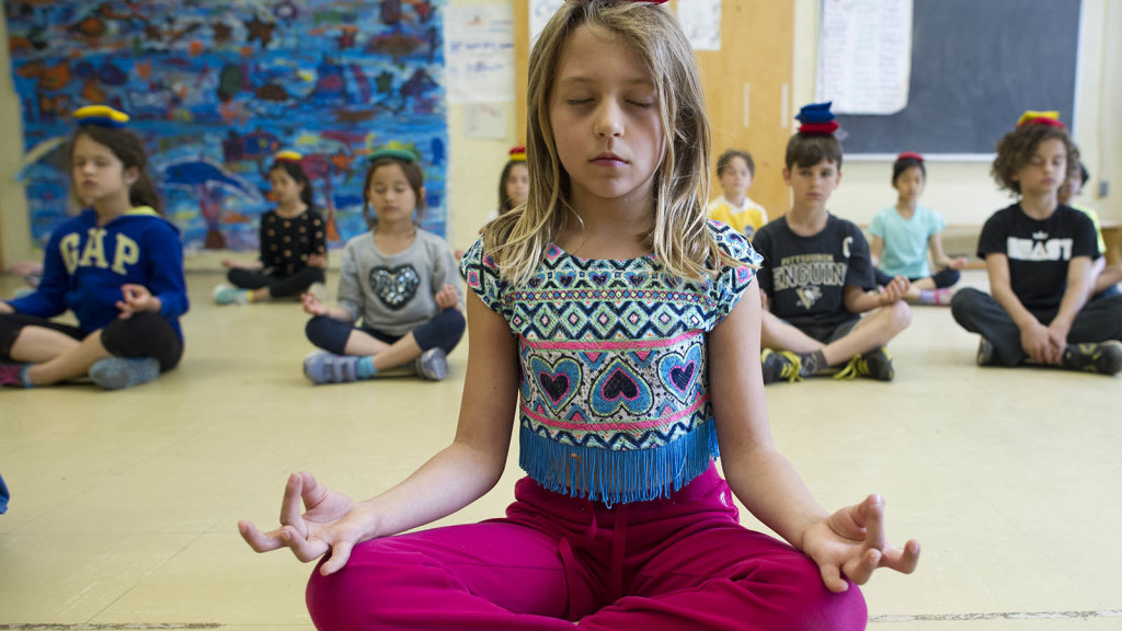 MACLEANS-MEDITATION-05.23.14-TORONTO, ON: Grade 3 students at the Dewson Street Junior Public School attend a meditation class called "Area 33." The class is run by Phys-Ed teacher Mary-Ann Kowal in an effort to promote relaxation and self reflection in a world where children are often over-managed and being told what to do on a constant basis. Photograph by Cole Garside